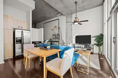 a kitchen and dining room with a table and chairs at 1700 Bassett, Unit 711 in Denver