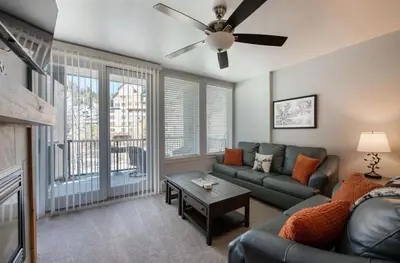 a living room with a couch and a ceiling fan at Premium Unit 4285 Fraser Crossing Founders Pointe condo in Winter Park