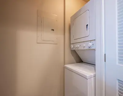 a white laundry room with a washer and dryer at Premium Unit 4285 Fraser Crossing Founders Pointe condo in Winter Park