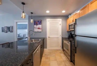 a kitchen with a stainless steel refrigerator and a sink at Premium Unit 4285 Fraser Crossing Founders Pointe condo in Winter Park