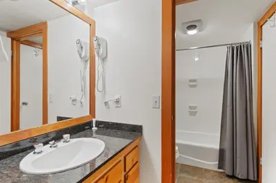 a bathroom with a sink and a shower at Decatur 1785 in Keystone