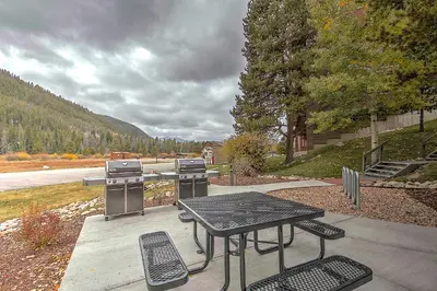 a grill and a table and chairs on a patio at Decatur 1785 in Keystone