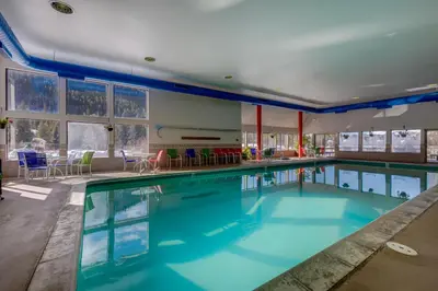 a swimming pool with blue water in a building at Decatur 1785 in Keystone