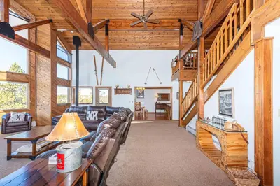 a living room with a couch and a table at Take a break from it all escape to the mountains in Grand Lake