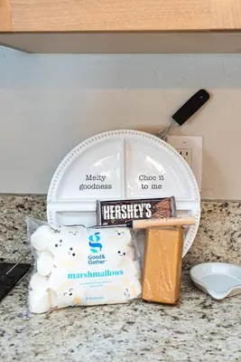 a counter top with a box of heinekens toothbrushes and other products at Base Camp Ski Slope Views Granby Ranch in Granby