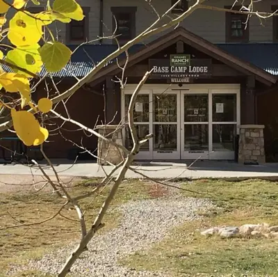 a building with a sign that reads glass cliff lodge at Base Camp Ski Slope Views Granby Ranch in Granby