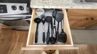 a drawer filled with utensils in a kitchen at Base Camp Ski Slope Views Granby Ranch in Granby
