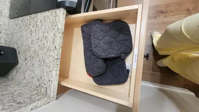 a bag in a wooden drawer in a room at Base Camp Ski Slope Views Granby Ranch in Granby