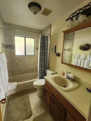a bathroom with a sink toilet and a mirror at Rocky Mountain National Park Entrance one Mile in Grand Lake