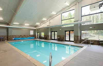 a large swimming pool in a large building at Riverfront Retreat Just 7 Minutes from the Resort, with a Hot Tub and Pool walk to downtown in Winter Park