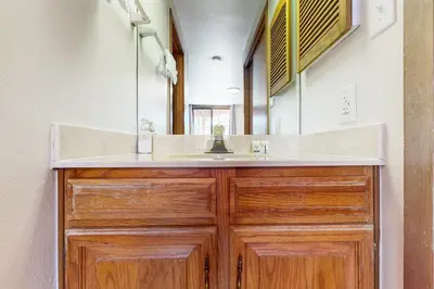 a bathroom with a sink and a mirror at Marina Place 413 in Dillon