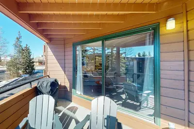 a screened in porch with two chairs and a window at Marina Place 413 in Dillon