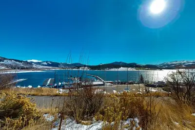 a view of a lake with snow on the ground at Marina Place 413 in Dillon