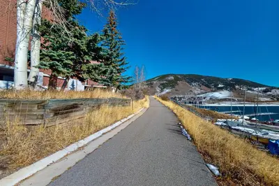 a road next to a marina with boats on it at Marina Place 413 in Dillon