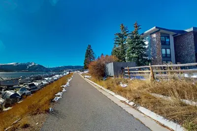 a road with a bunch of cars parked next to a building at Marina Place 413 in Dillon