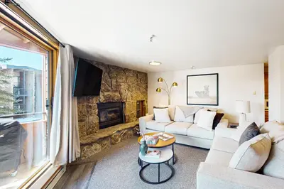 a living room with a couch and a fireplace at Marina Place 413 in Dillon