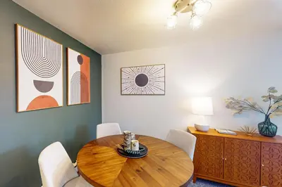 a dining room with a wooden table and chairs at Marina Place 413 in Dillon