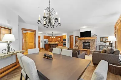 a dining room and living room with a table and chairs at Lone Eagle 3012 in Keystone