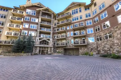 a large apartment building with a brick courtyard at Lone Eagle 3012 in Keystone