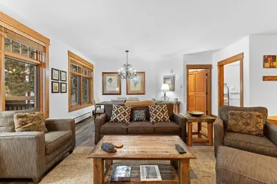 a living room with couches and a table at Lone Eagle 3012 in Keystone