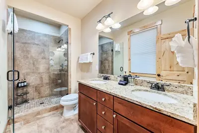 a bathroom with two sinks and a shower at Modern Keystone Townhome Next to River Run Village in Keystone