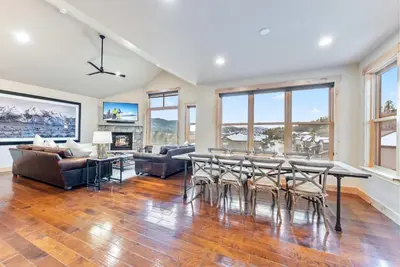 a large living room with a table and chairs at Modern Keystone Townhome Next to River Run Village in Keystone