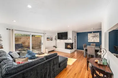 a living room with a couch and a table at Foothills Escape - 10 min to Red Rocks in Lakewood