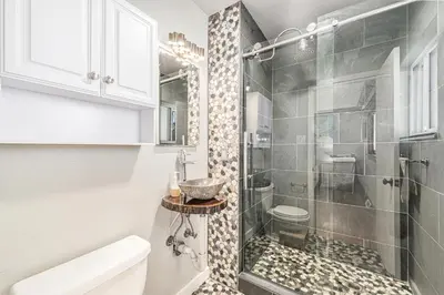 a bathroom with a shower and a sink at Foothills Escape - 10 min to Red Rocks in Lakewood
