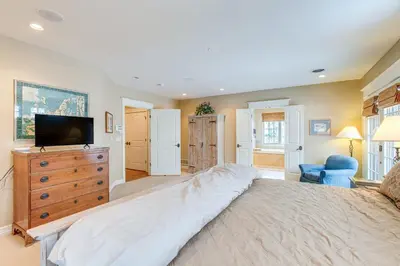 a large bedroom with a large bed and a television at Walk to DU, Dining and Parks Spacious Denver Home! in Denver