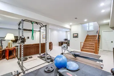 a living room with a gym with a blue balloon at Walk to DU, Dining and Parks Spacious Denver Home! in Denver