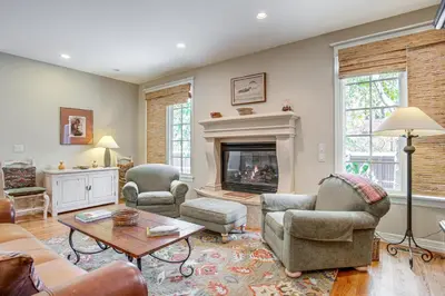a living room filled with furniture and a fireplace at Walk to DU, Dining and Parks Spacious Denver Home! in Denver