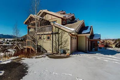 a house with a snow covered driveway in front of it at Byers Peak Mountain Escape – Winter Park Retreat with Scenic Views in Fraser