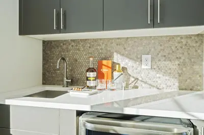a kitchen with a sink and a counter top at Mountain View Home with King Beds and Rooftop Deck in Fort Collins