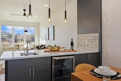 a kitchen with a sink and a counter top at Mountain View Home with King Beds and Rooftop Deck in Fort Collins
