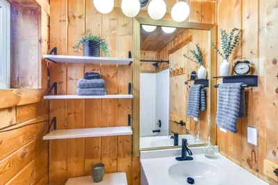 a bathroom with a sink and a mirror at Mtn-View Haven with Hot Tub 9 Mi to Dtwn Bailey in Bailey