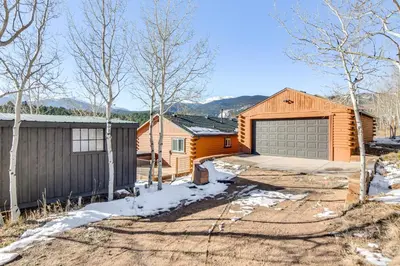 a home with a garage and a house at Mtn-View Haven with Hot Tub 9 Mi to Dtwn Bailey in Bailey