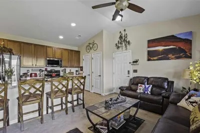 a living room with a couch and a table at Aspen Meadows F-304, 0014 in Granby