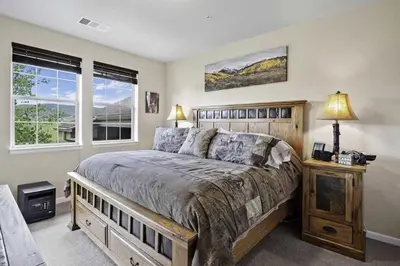 a bedroom with a large bed and a window at Aspen Meadows F-304, 0014 in Granby