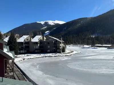 arial view of a snow covered street with houses at Beautiful Renovated 1BR Lakeside Condo condo in Keystone