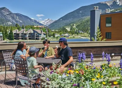 a group of people sitting at a table eating ice cream at Beautiful Renovated 1BR Lakeside Condo condo in Keystone