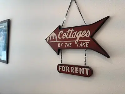 a sign hanging on a wall that reads cities by the lake at Beautiful Renovated 1BR Lakeside Condo condo in Keystone