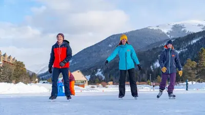 a group of three people standing in the snow at Lakeside, spacious, modern 2BR - sleeps up to 8 condo in Keystone