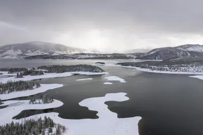 an aerial view of a lake in the snow at Lake Forest Mountainview Condo: Great Location, Amazing Views in Frisco
