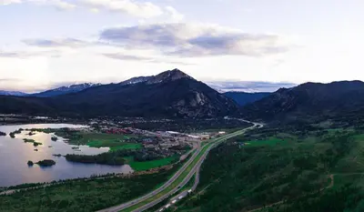 an aerial view of a city and a lake and mountains at Woodbridge Inn Getaway: Pet Friendly, Mountain Views in Frisco