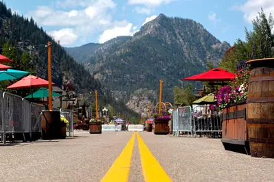a street with a yellow line in the middle of a mountain at Woodbridge Inn Getaway: Pet Friendly, Mountain Views in Frisco