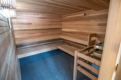 a sauna with wooden walls and a blue floor at Mountainside Royalview Condo: Pool/Hot Tubs, Great Location in Frisco