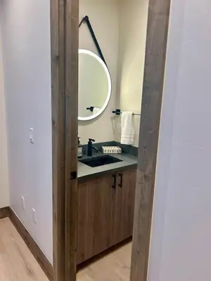a bathroom with a sink and a mirror at Brand New Eagles Nest Property in Silverthorne