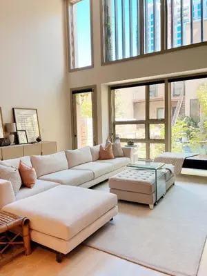 a living room with couches and a table and windows at Luxe 4 bed 5 bath with Parking Walk to Capitol, Convention Center, museums and shops in Denver