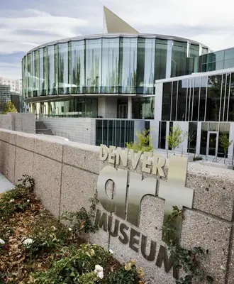 a building with a sign in front of it at Luxe 4 bed 5 bath with Parking Walk to Capitol, Convention Center, museums and shops in Denver