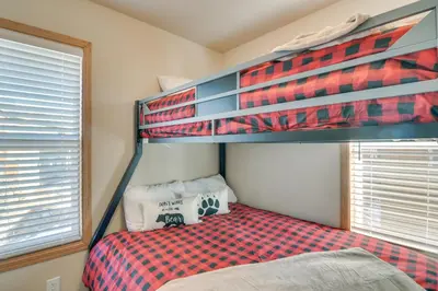 a bedroom with a bunk bed in a room at 4 Mi to Granby Ranch Cabin with Hot Tub Access! in Granby